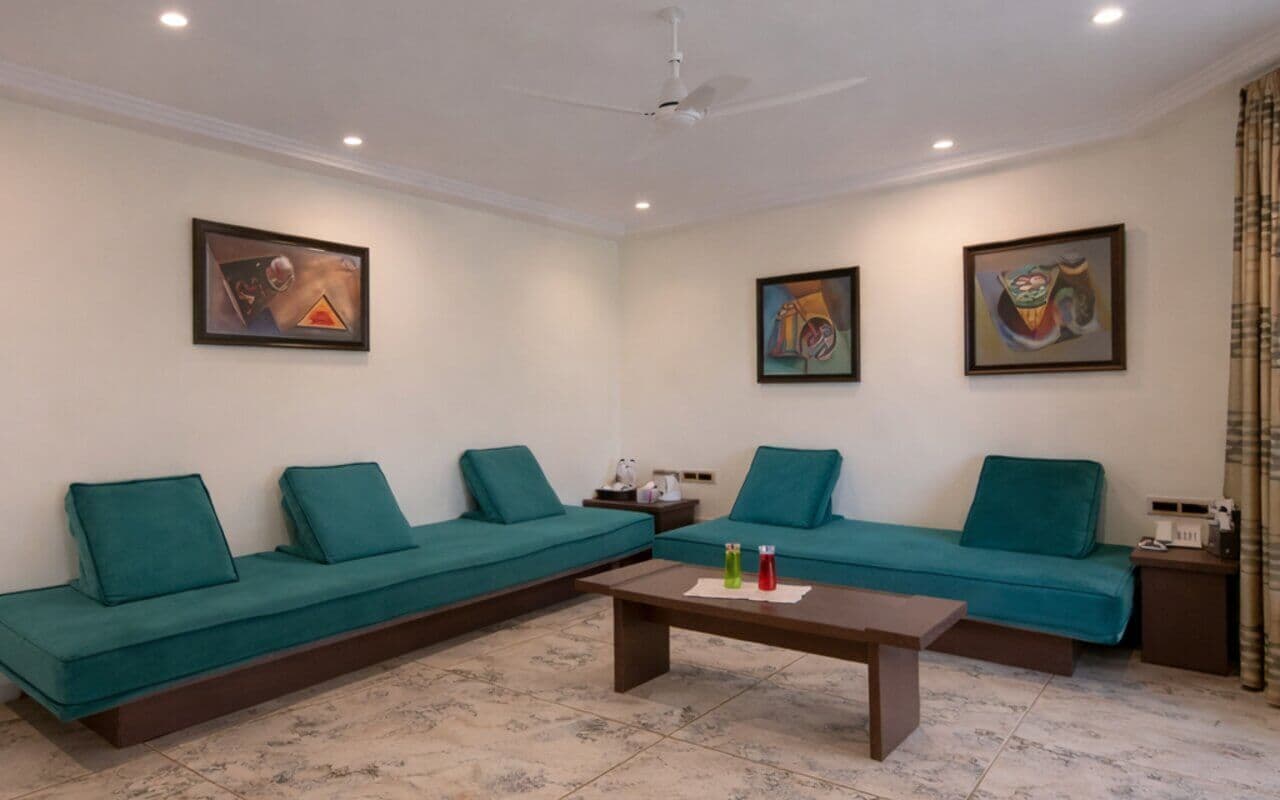 Macaw Villa bedroom with luxury bath area at Manas Resort, Igatpuri