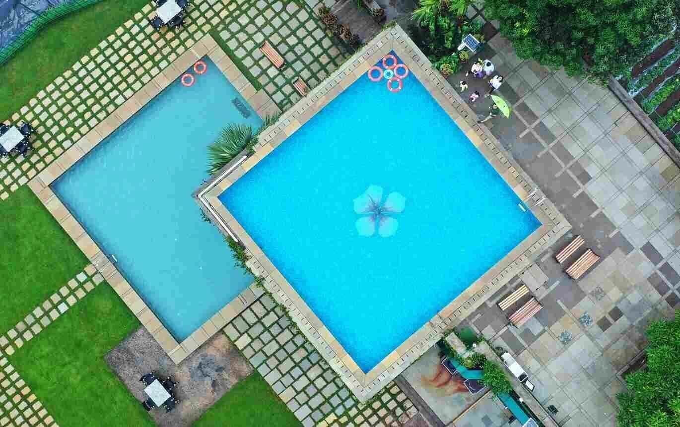 Aerial view of the infinity swimming pool at Manas Resort, Igatpuri